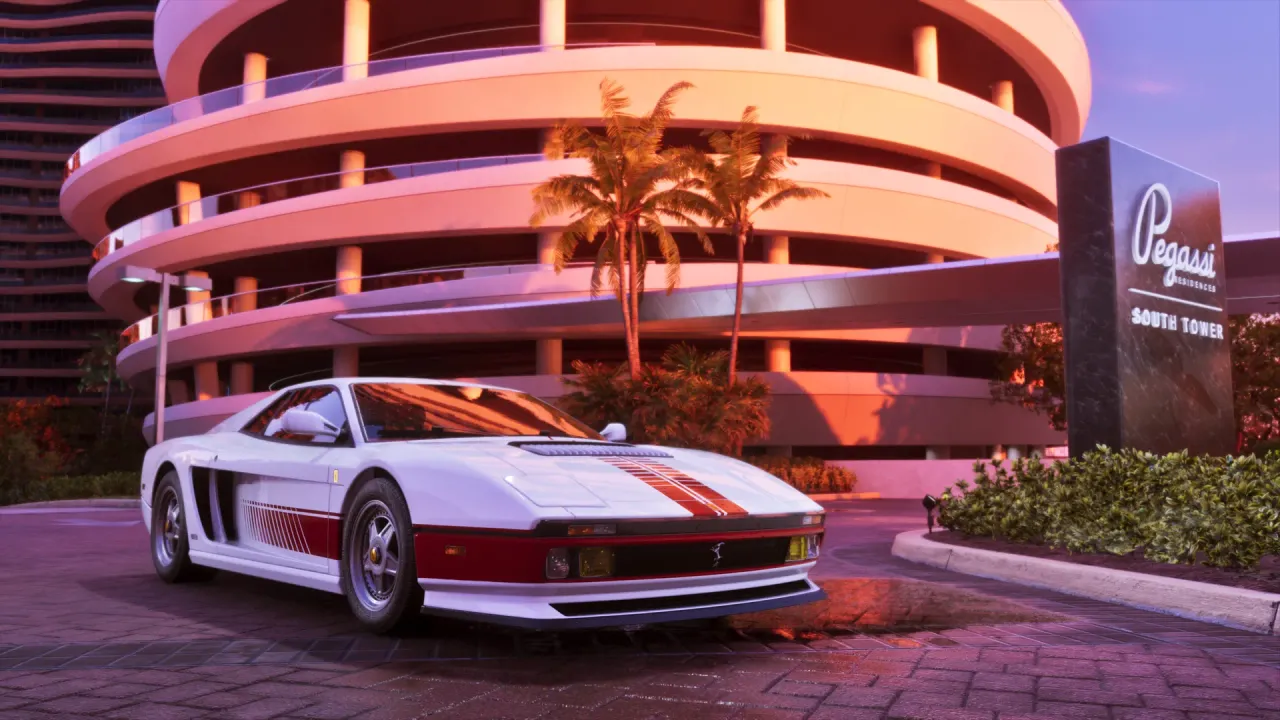 White Grotti Cheetah with red stripes parked in front of a spiral parking garage at sunset