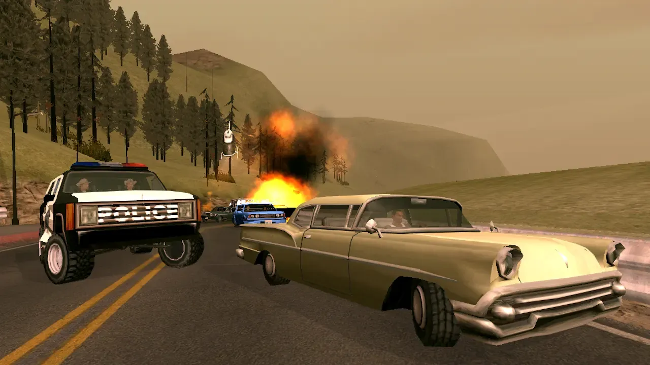 Original game, 2013 mobile release: a police SUV chases an old sedan along a forested hillside road as a car burns behind them