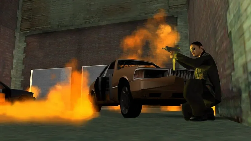 Original game (Xbox 360 release): a man in a dark suit and sunglasses crouches by a wall and fires a pistol as a car burns in front of him