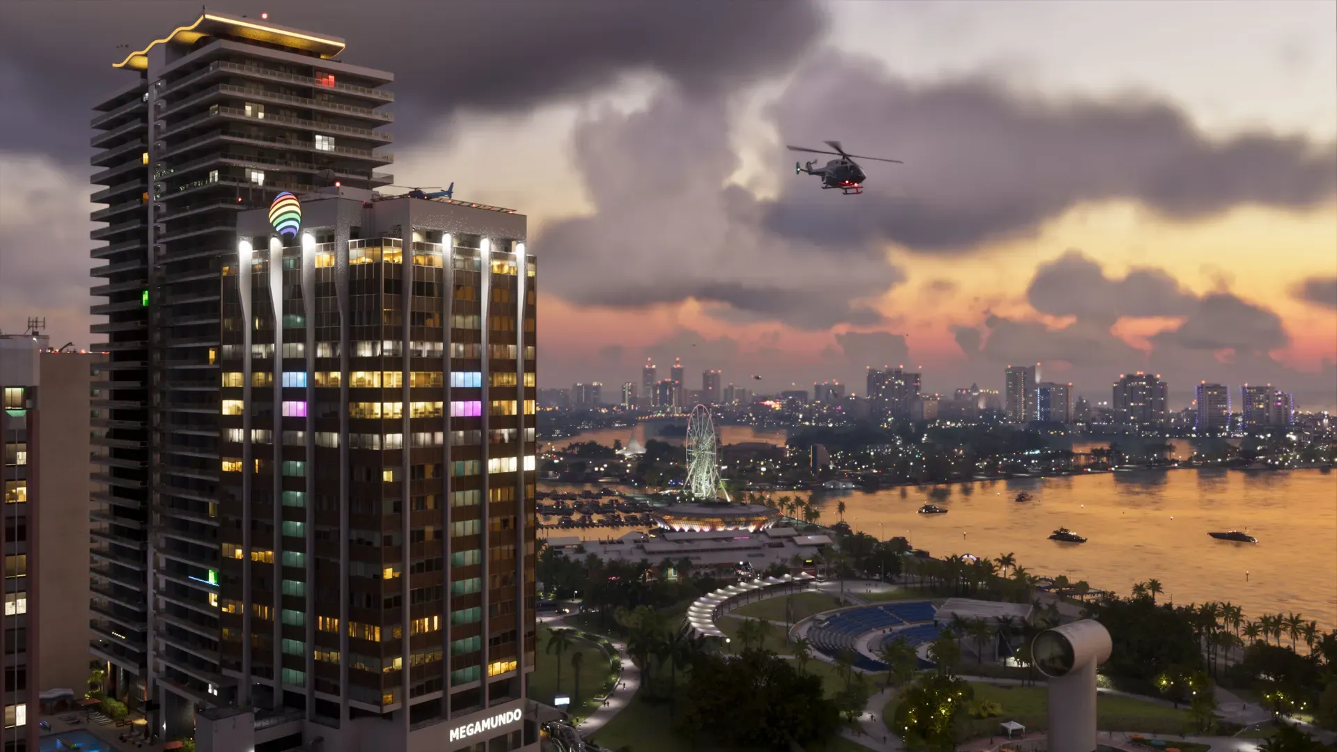 A lit skyscraper overlooking the bay in Vice City at dusk, with a helicopter in the sky.