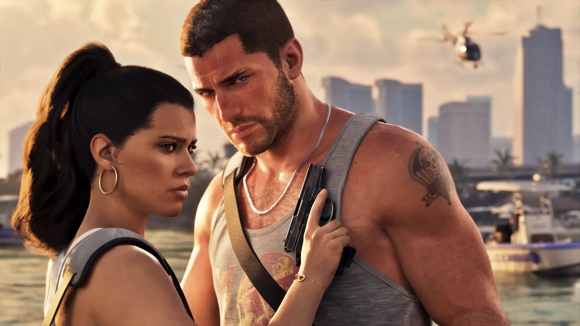 Lucia and Jason stand close together by the water, with the Vice City skyline and a helicopter behind them.