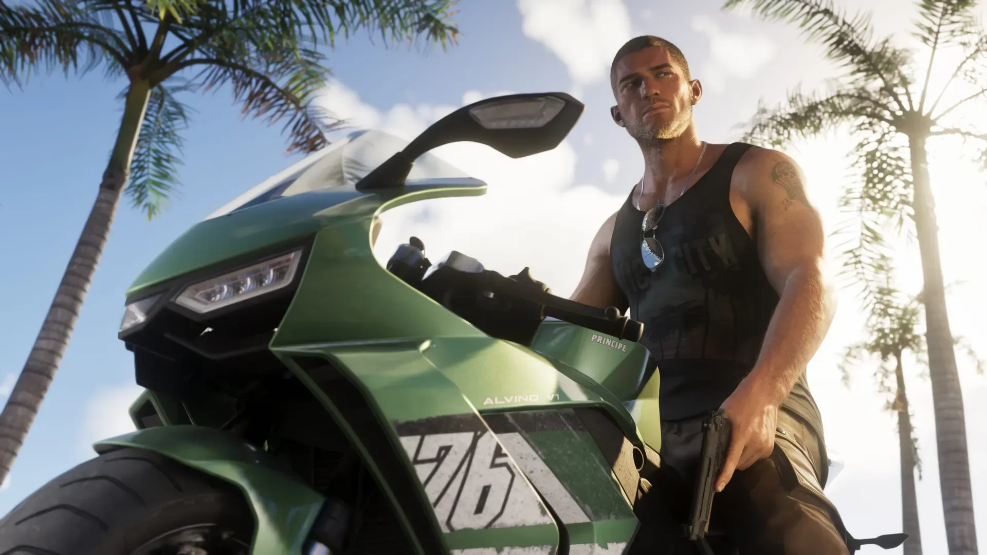 Jason beside a green sport motorcycle
