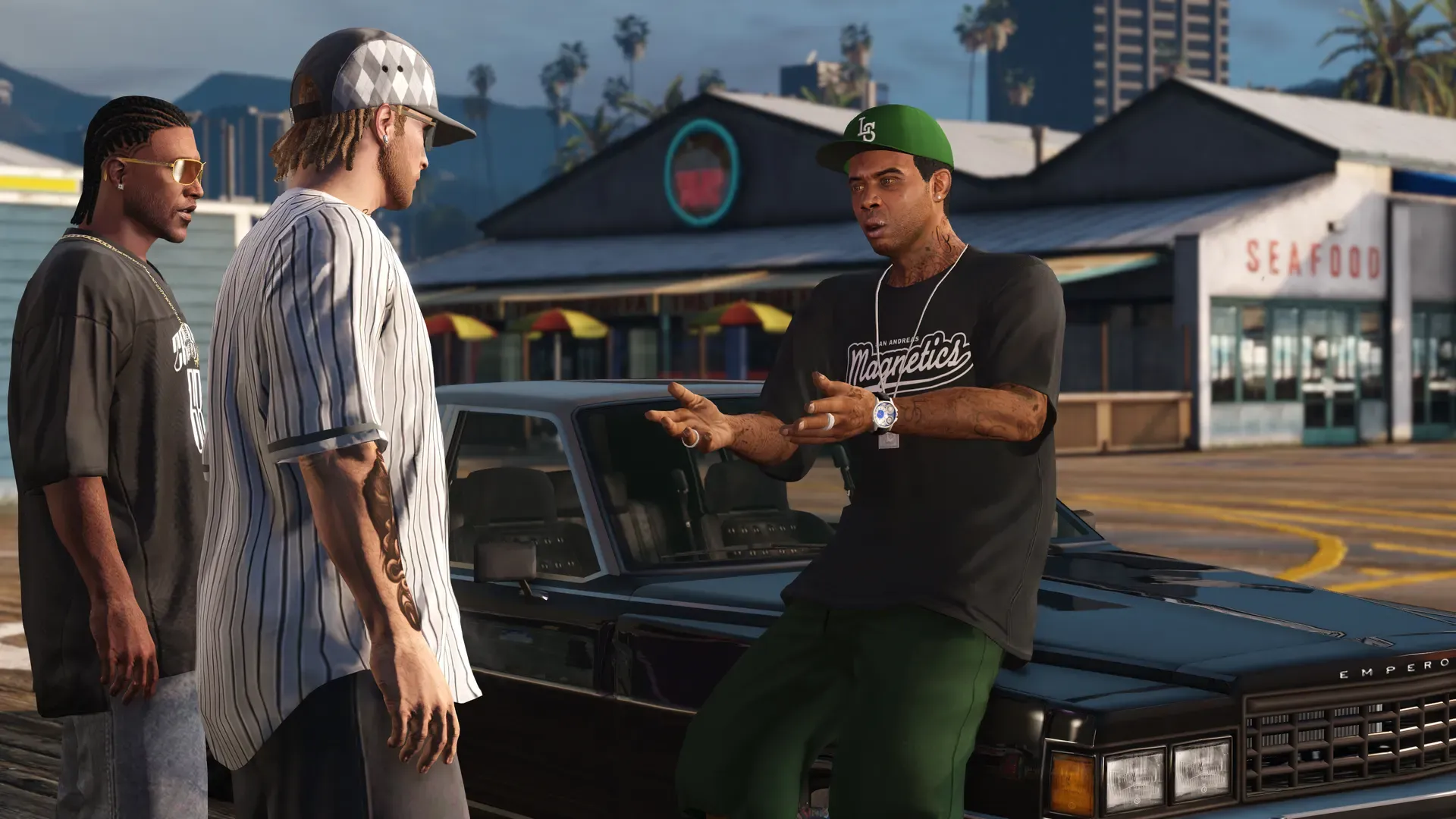 Lamar in a green cap and black tee talks with two friends beside a dark lowrider outside a seafood shack