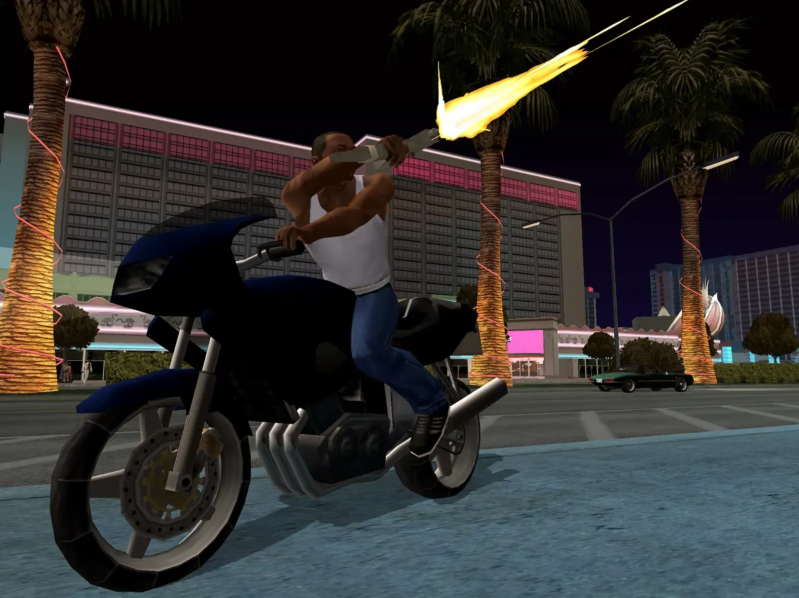 Original game, 2013 mobile release: CJ fires a gun from a dark motorcycle in front of a large neon lit hotel at night