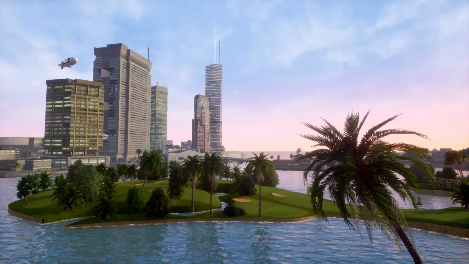 A golf course island with palm trees in the bay, with tall office towers and a blimp against a pink evening sky