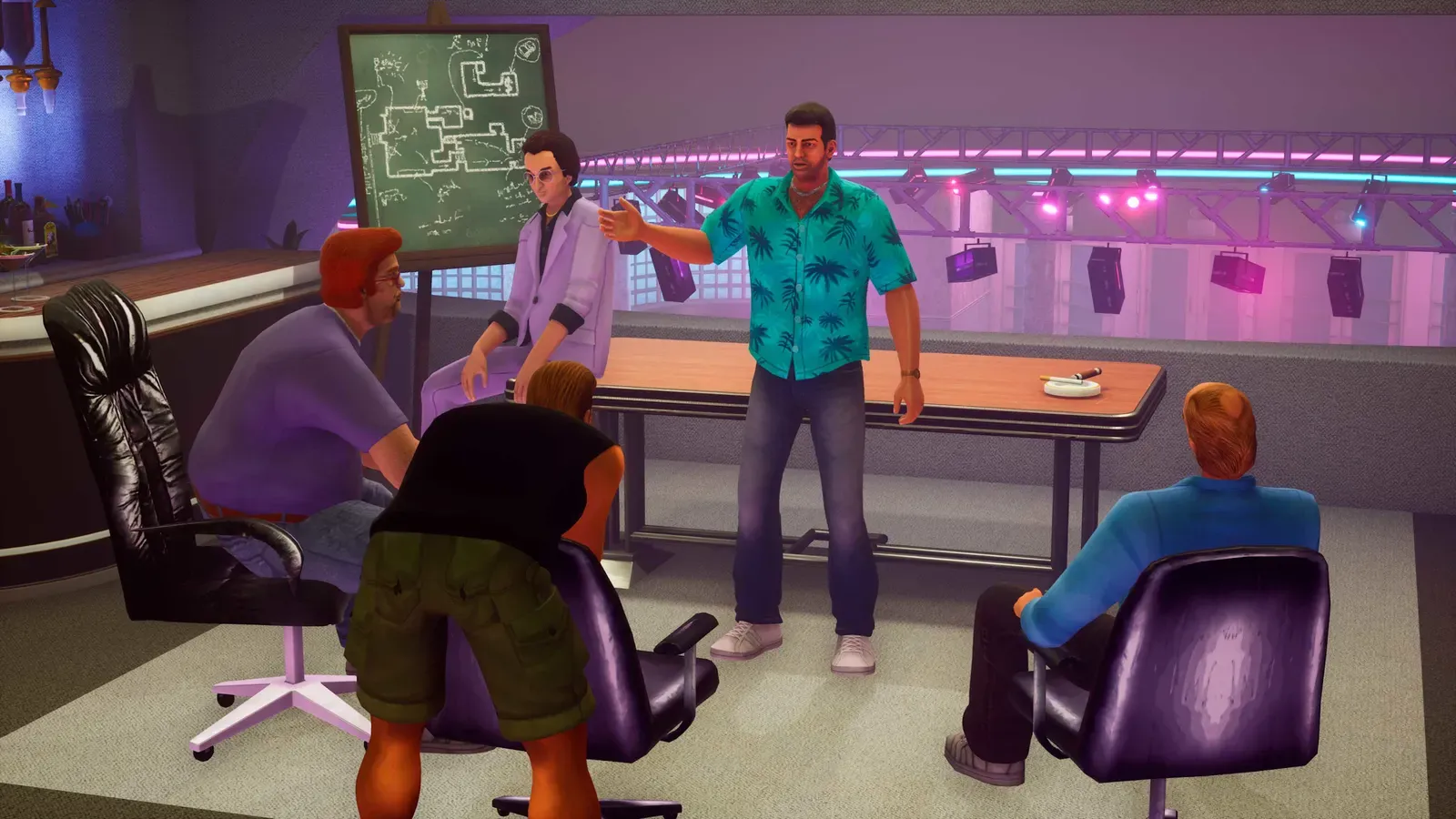 Tommy briefs a crew of men around a table above a nightclub dance floor, with Ken Rosenberg sitting by a chalkboard plan