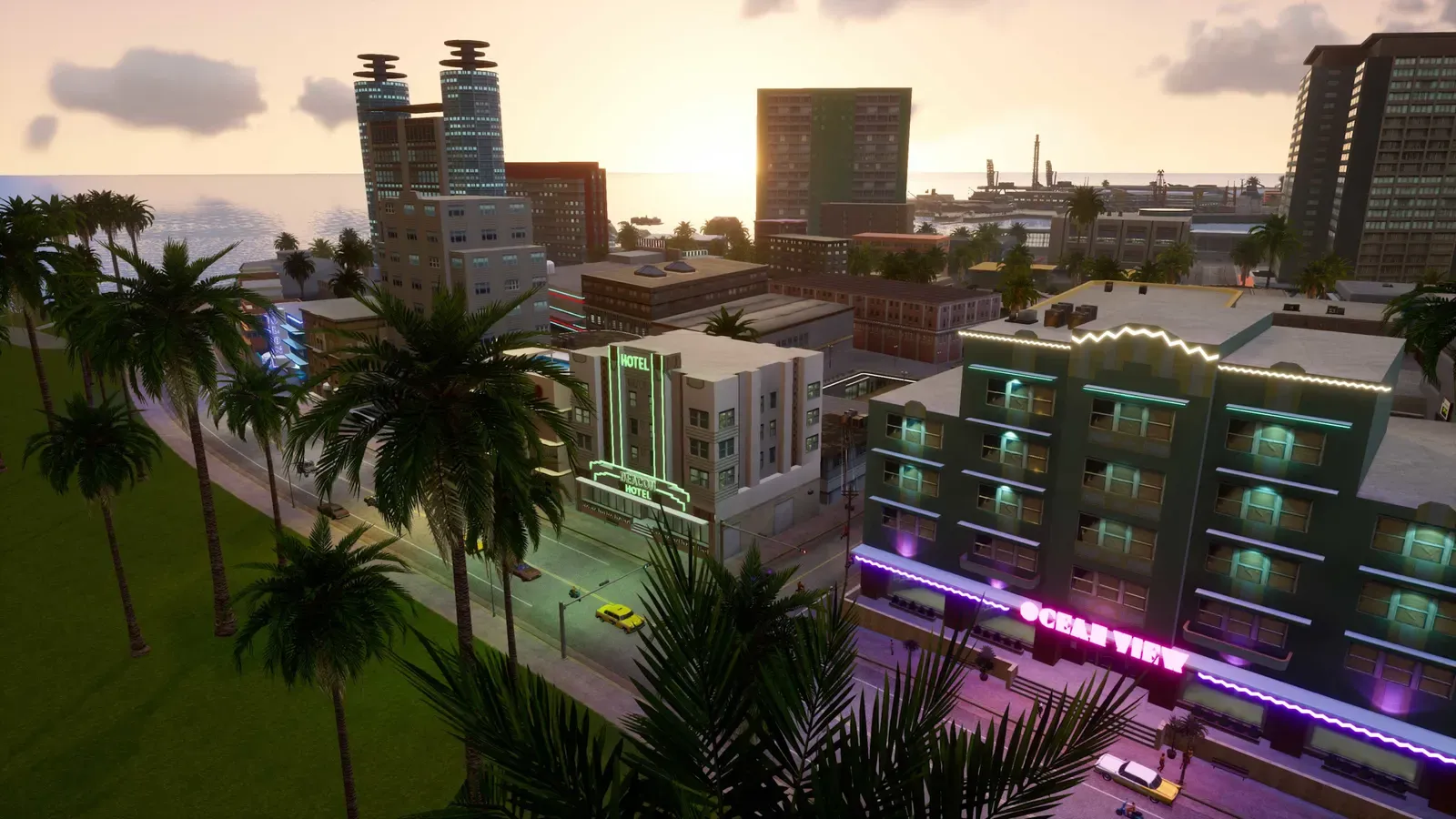 Evening view over the rooftops of Ocean Beach, with palm trees, the neon Ocean View hotel sign and the sea beyond