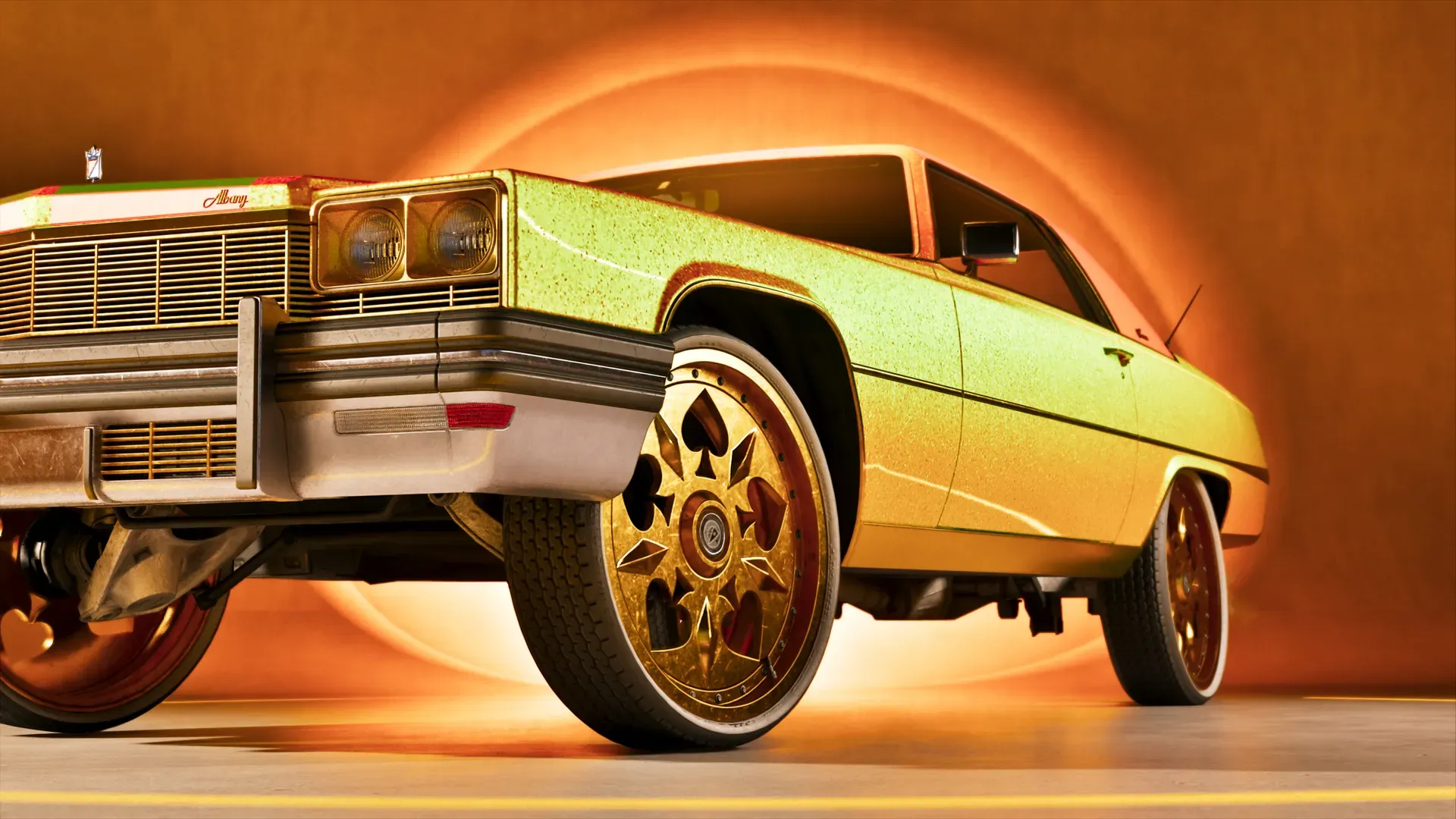 A gold sedan on big rims at Rideout Customs