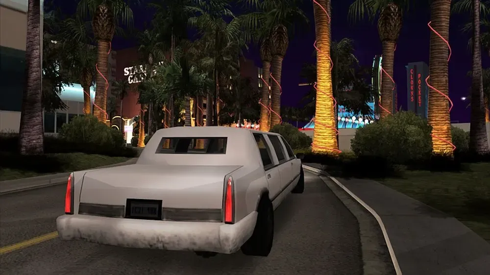 Original game (Xbox 360 release): a white stretch limousine drives along a palm lined road at night with the Starfish Casino and Clown's Pocket signs behind it