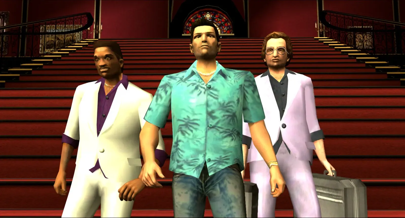 Tommy in his Hawaiian shirt walks down a red carpeted staircase between Lance Vance and Ken Rosenberg, in the 2012 mobile edition