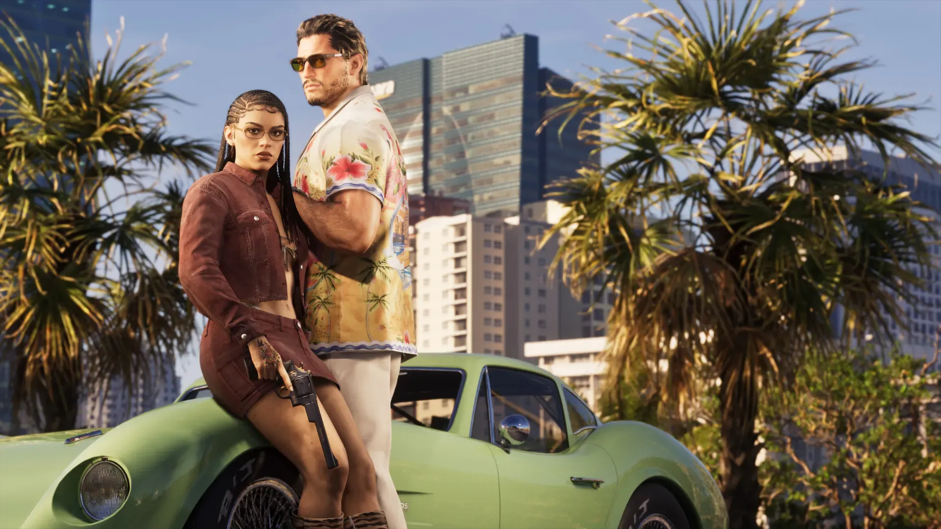 Jason and Lucia with a classic sports car