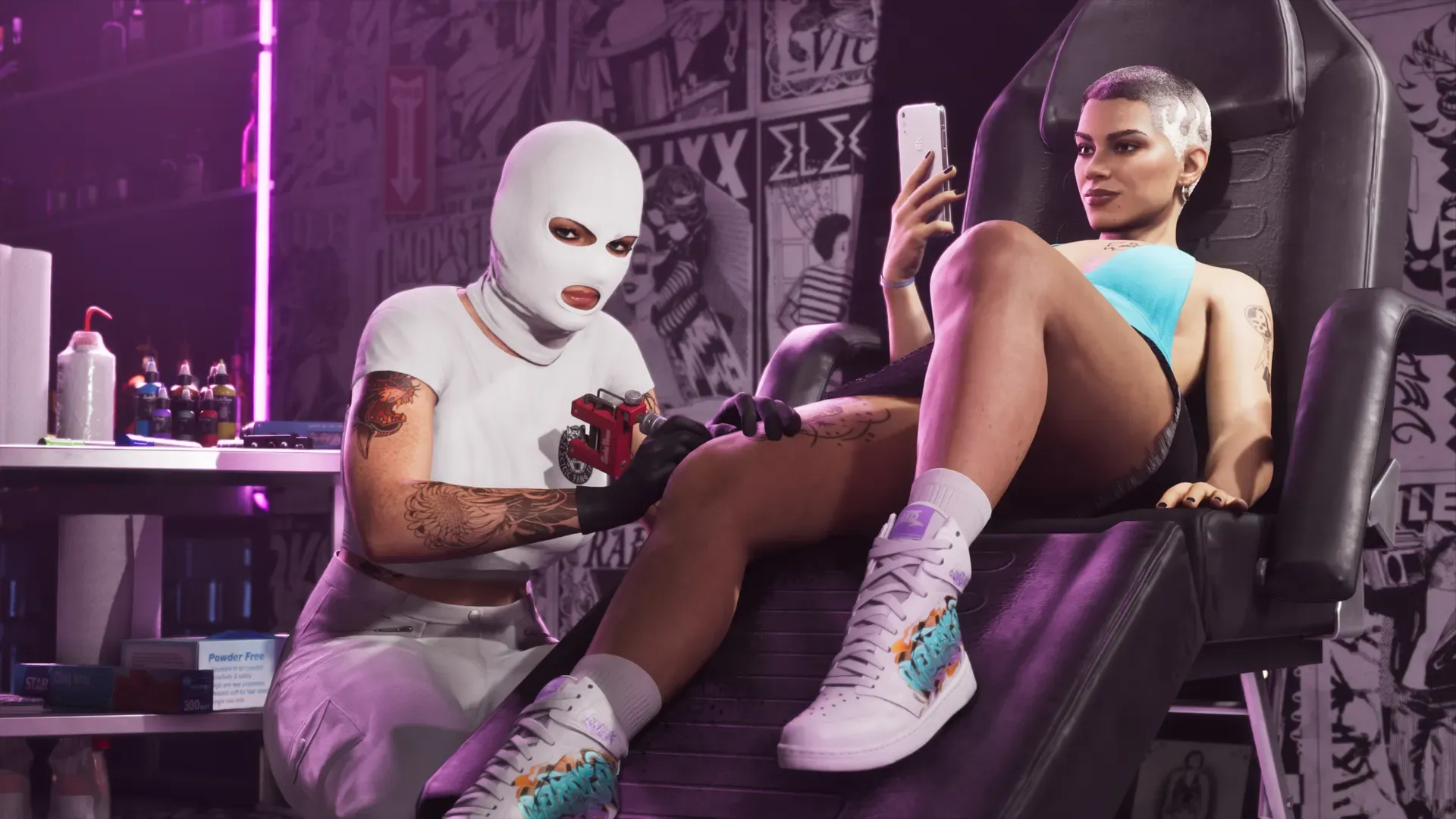 Lucia with a buzz cut sits in a tattoo chair on her phone as a tattoo artist in a white ski mask tattoos her thigh.