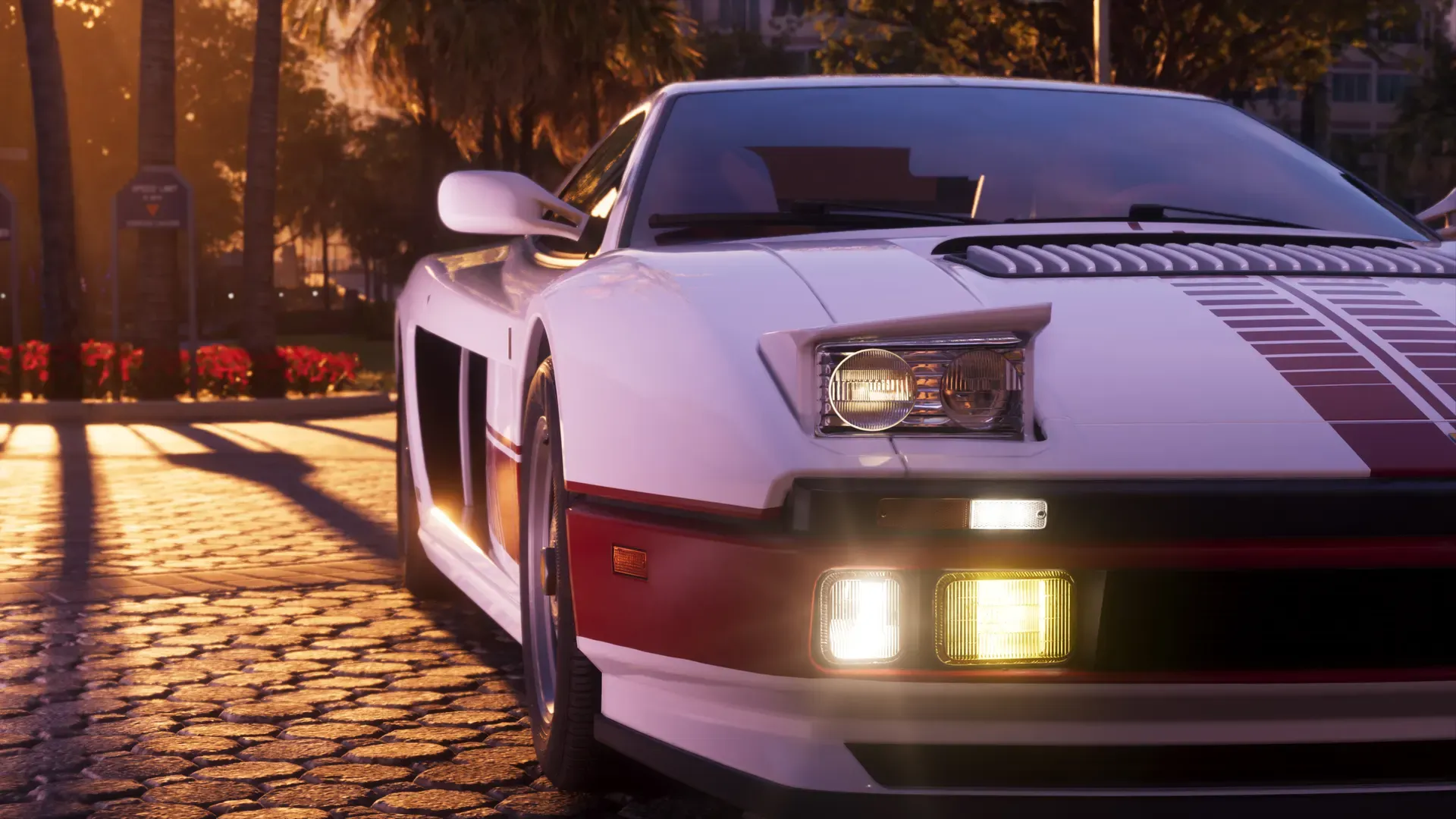 A white Grotti Cheetah with a minimalist, retro-futuristic livery is parked with its headlamps up.