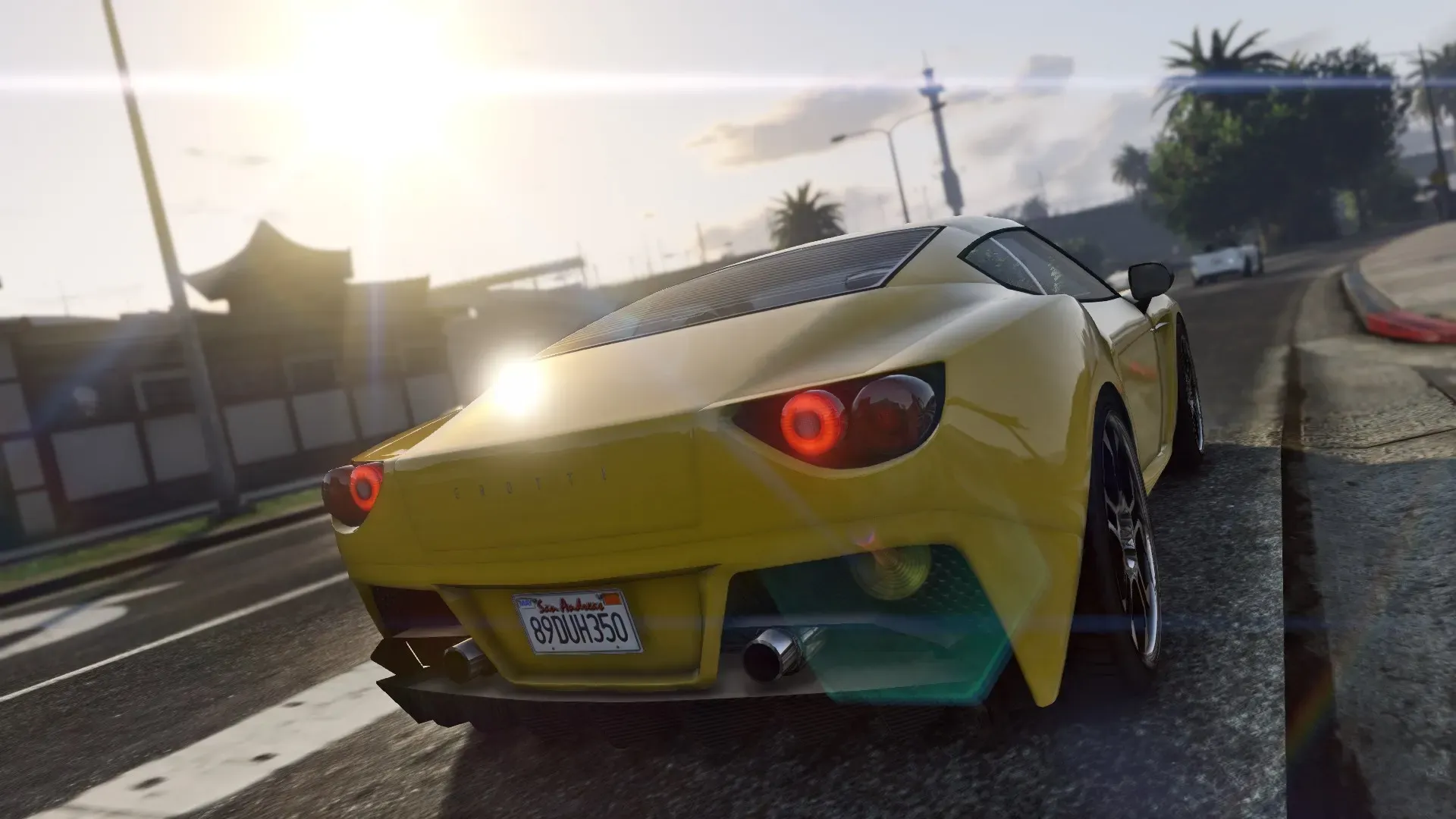 A yellow sports car speeds away down a sunlit street, its tail lights glowing